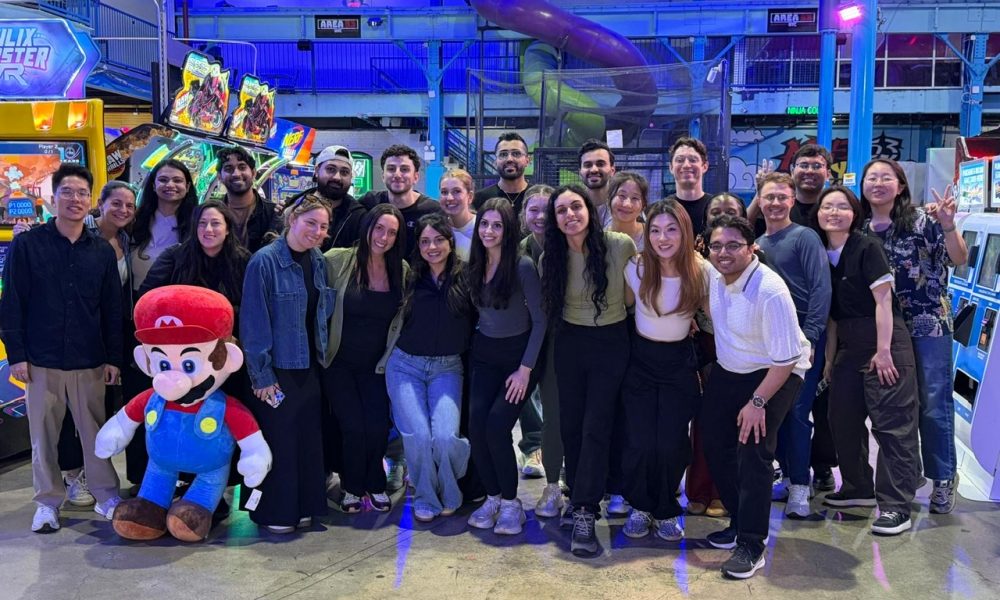 Psychiatry residents pose for group photo at indoor game and play facility